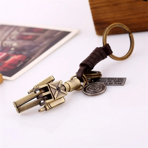 Handwoven leather keychain featuring a vintage bronze robot pendant and retro metal charms