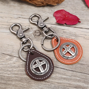Vintage cross leather keychain in brown with religious metal charms for men
