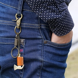 Retro vintage men's brass metal keychain with a mini axe pendant and leather cover