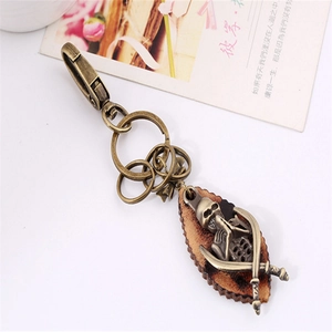 Vintage punk skull keychain with genuine leather leaf pendant and bronze carabiner hook