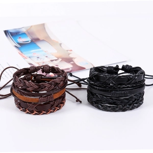 Detail of vintage woven leather bracelet sets with adjustable knots in brown and black