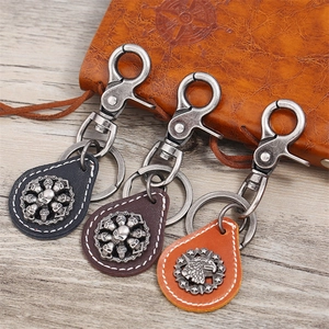 Retro leather skull and eagle keychain set in black, brown and yellow vintage finishes