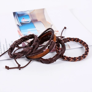 Set of four vintage braided multilayer leather bracelets in dark brown and chocolate tones