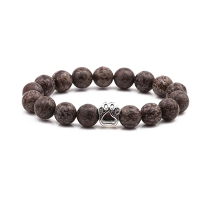 10mm reddish-brown beaded bracelet with silver paw print charm on white background