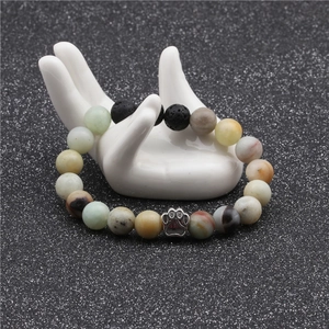 Detail of 10mm beaded bracelet with natural stones and silver metal paw print charm