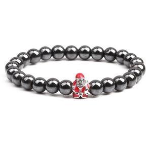 Magnetic hematite beaded bracelet featuring a red and white Santa Claus enamel charm