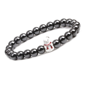 Close-up of magnetic hematite beaded bracelet with a cute snowman festive charm