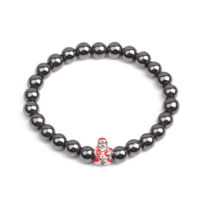 Detail of hematite beaded bracelet featuring a colorful Santa Claus charm for Christmas