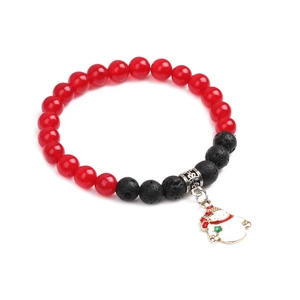 Close-up of Christmas bracelet with red agate beads, volcanic stone and snowman charm