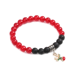 Detail of Christmas bracelet with red beads, black lava stone and reindeer charm