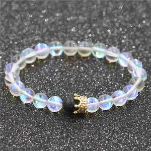 Aurora moonstone beaded crown bracelet set with black lava stone on starry background