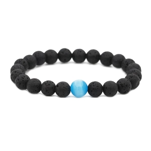 Lava stone distance bracelet with black volcanic beads and a blue centerpiece bead
