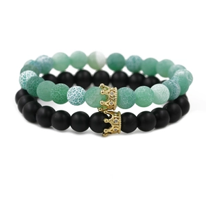 Green lava stone and black matte bead crown bracelet set for couples with gold accents
