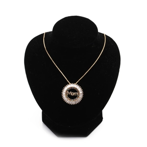 Golden Mom pendant necklace with micro-p镶 inlaid zircons on a black velvet display stand