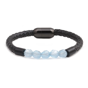 Detail of woven black leather bracelet with five faceted blue beads and magnetic clasp