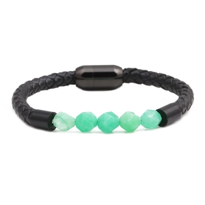 Close-up of black braided leather bracelet with faceted green natural stones and magnetic clasp