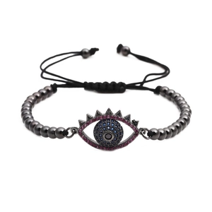 Adjustable evil eye braided bracelet with blue and rose red cubic zirconia copper beads