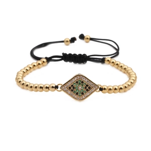 Bracelet ajustable à perles dorées avec charme de l'œil maléfique en zircon vert
