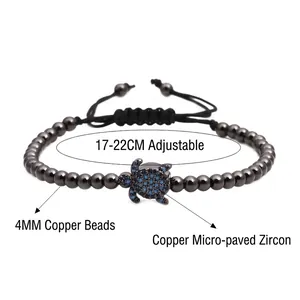 Bracelet tressé réglable avec perles métalliques de 4mm et pendentif tortue en zircon bleu