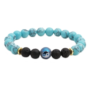Yin Yang lava stone and turquoise beaded bracelet with golden metallic spacer accents