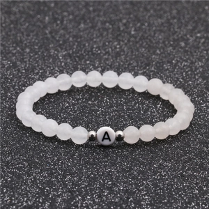 6mm white turquoise beaded bracelet featuring a silver metal bead and letter A charm