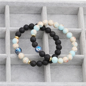 Yin Yang lava rock beaded bracelet set with light blue stones and golden spacers