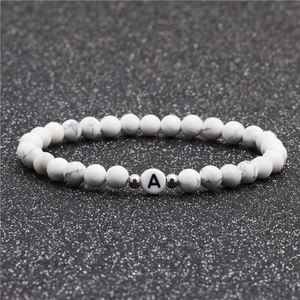 6mm white turquoise beaded bracelet featuring a white alphabet A bead and silver spacers