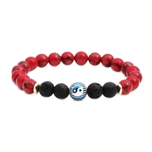 Lava stone bead bracelet with red turquoise and Yin Yang symbol on white background