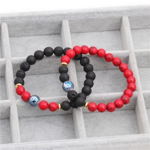 Set of two yin yang lava stone bracelets with red turquoise beads and gold spacers