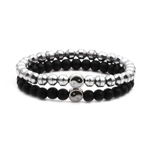 Detail view of Tai Chi Yin Yang bead bracelets with matte black and polished silver beads