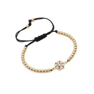 Bracciale regolabile con perline dorate e ciondolo a fiore esagonale in zirconi colorati