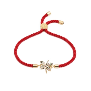 Adjustable red woven string bracelet with a colorful dragonfly charm in gold finish