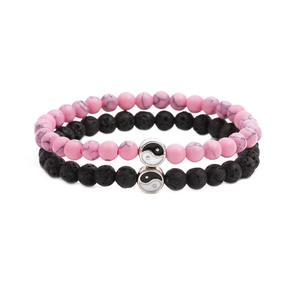 Stone bead bracelet set featuring pink turquoise and black lava rock with Yin Yang charm