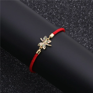 Adjustable red cord bracelet with gold dragonfly pendant and multicolor cubic zirconia