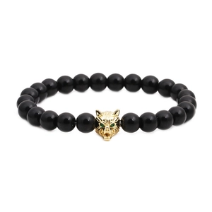 Bracelet en perles d'onyx noir poli avec tête de loup dorée et petits yeux verts