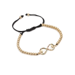 Bracciale intrecciato regolabile con perle dorate e simbolo infinito in zircone colorato