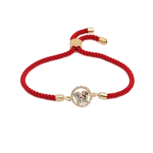 Adjustable red cord bracelet with a gold butterfly charm set with colorful cubic zirconia