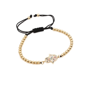 Bracciale intrecciato mano di Fatima dorata con zirconi colorati in micro-pavé