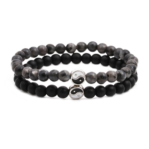 Matte black and grey stone beaded bracelet set with Tai Chi Yin Yang symbol charms