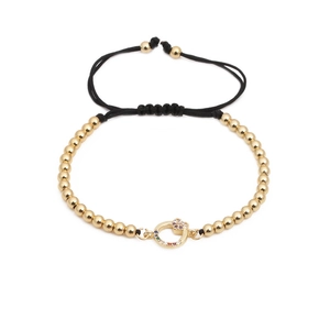 Bracciale intrecciato regolabile con perline dorate e ciondolo cuore in zircone colorato