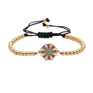 Bracciale intrecciato regolabile con perline dorate e ciondolo in zircone ottagonale