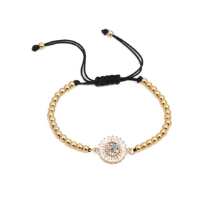 Bracciale intrecciato regolabile con perle dorate e ciondolo girasole in zircone