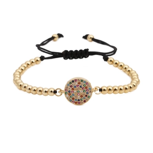 Bracciale intrecciato regolabile con perline dorate e ciondolo a cerchio in zirconi