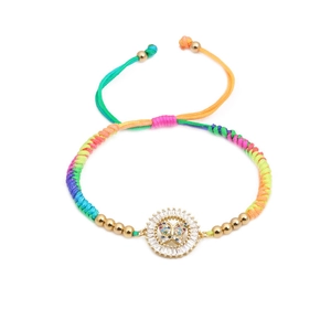 Rainbow woven cord bracelet featuring a gold butterfly pendant with colorful gemstones