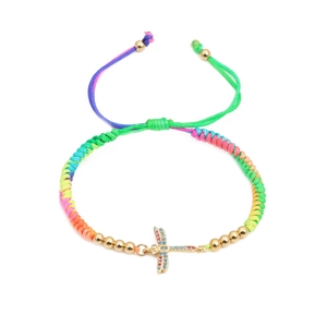 Adjustable colorful braided bracelet with a gold dragonfly charm and micro-inlaid zircons