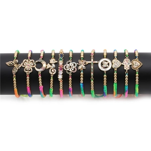 Ethnic woven bracelets set with gold-plated zircon pendants in various shapes