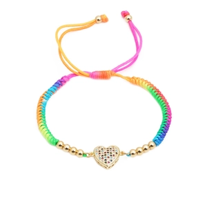 Handmade rainbow woven bracelet featuring a micro-set zircon heart pendant with gold beads