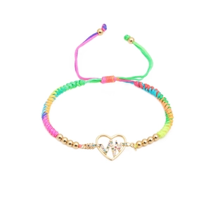 Detail of colorful woven adjustable bracelet with gold heart charm and zircon inlay