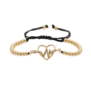 Adjustable woven bracelet with gold beads and heart charm featuring colorful zircon heartbeat