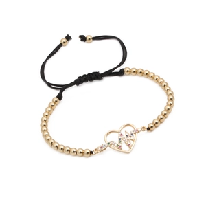 Adjustable woven bracelet with gold heartbeat heart pendant and colorful cubic zirconia